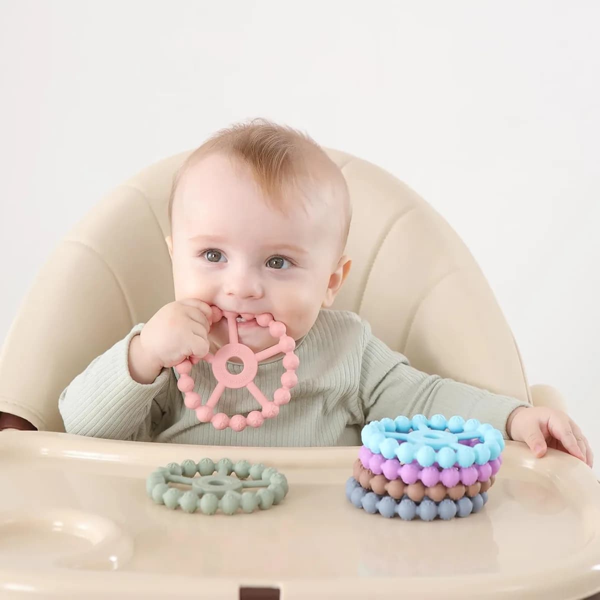 baby chewing a silicone ring teether, gallery view 5