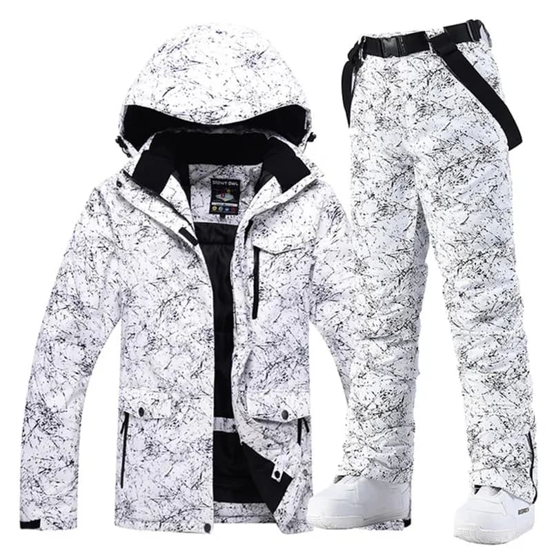White and black abstract patterned snowboarding jacket and pants set with hood and belt for winter sports.